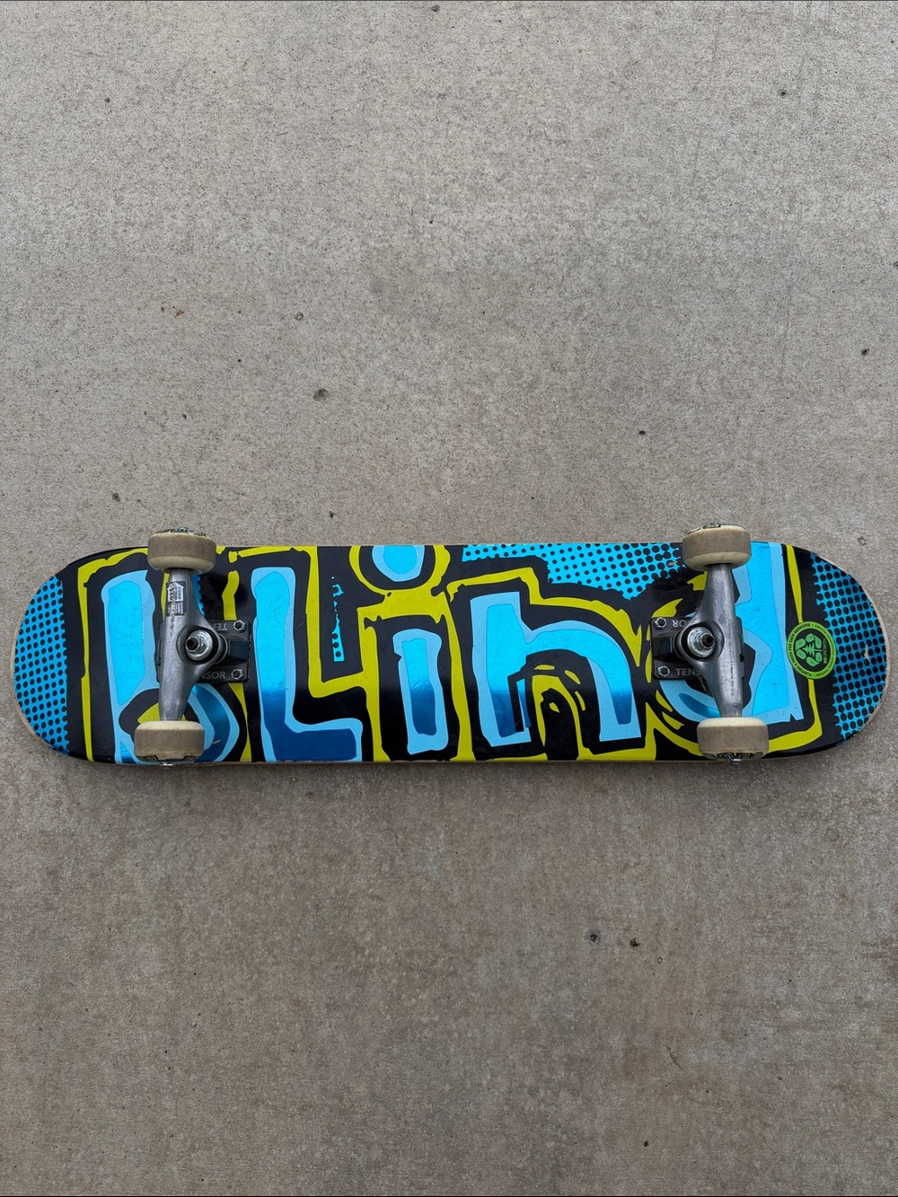 Blue and Yellow Graphic Skateboard